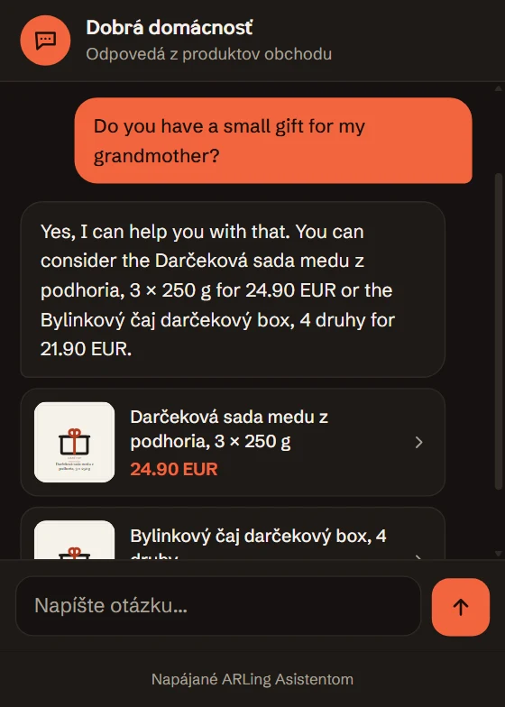 Zákazník píše po anglicky: Do you have a small gift for my grandmother? Asistent odpovie po anglicky a ponúkne darčekovú sadu medu za 24.90 EUR a darčekový box bylinkových čajov za 21.90 EUR, s kartami produktov.